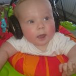 a baby with headphones