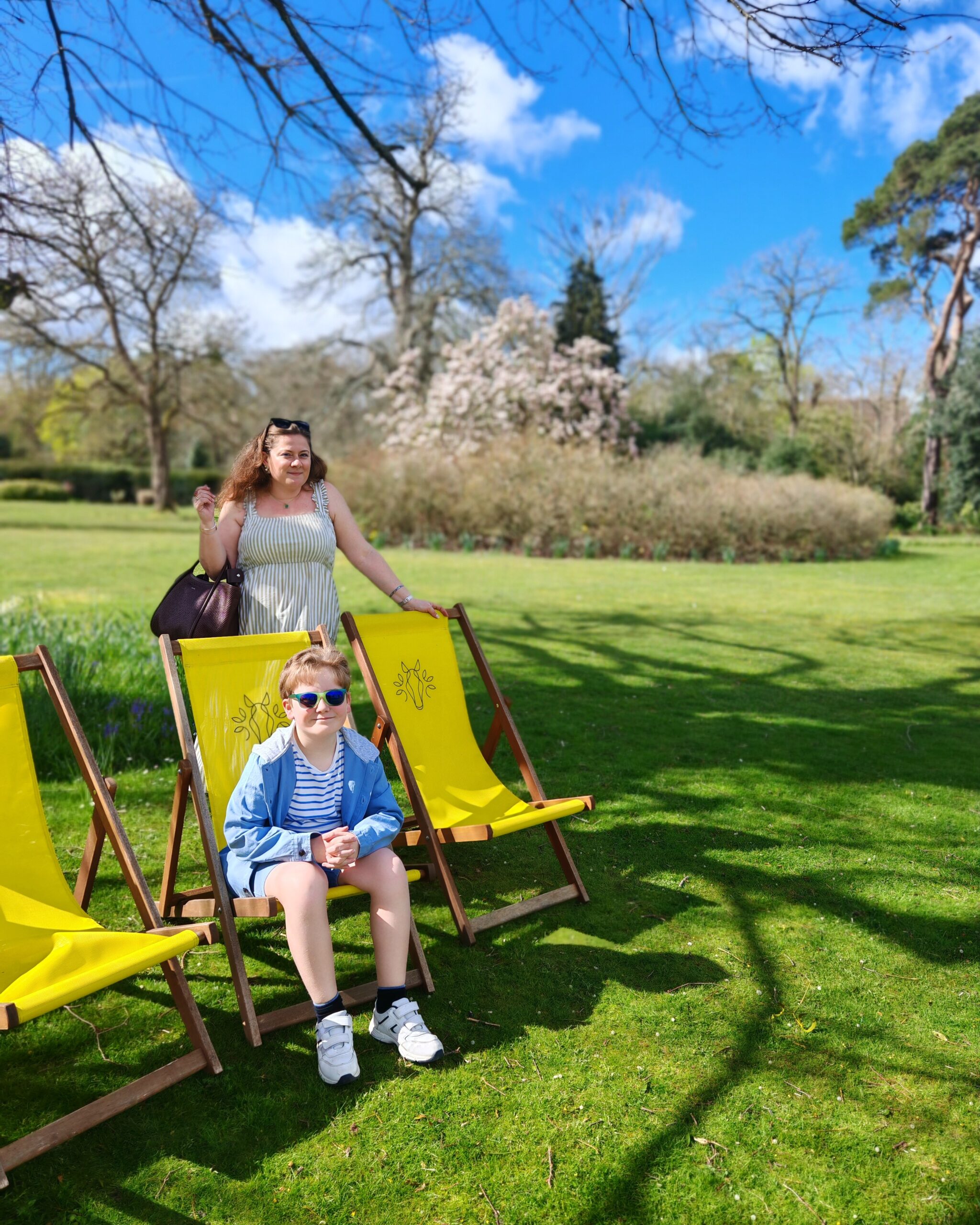 A mum and her boy sitting in a yellow deckchair ain an hotel from the Exclusive Group. They both look happy and the sun shine is out. A mum and her boy sitting in a yellow deckchair ain an hotel from the Exclusive Group. They both look happy and the sun shine is out.