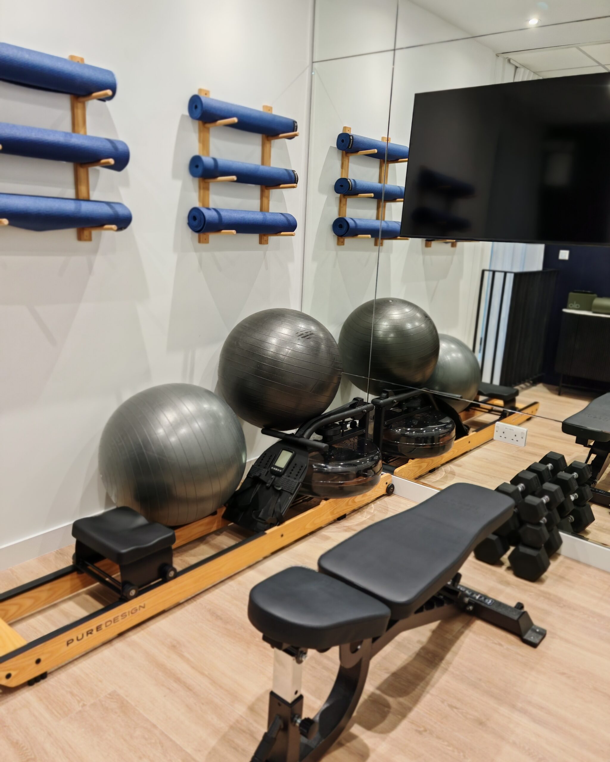 the gym area at onefifty fenchurch with yoga balls, yoga mats on the wall and weights to do strength workouts the gym area at onefifty fenchurch with yoga balls, yoga mats on the wall and weights to do strength workouts