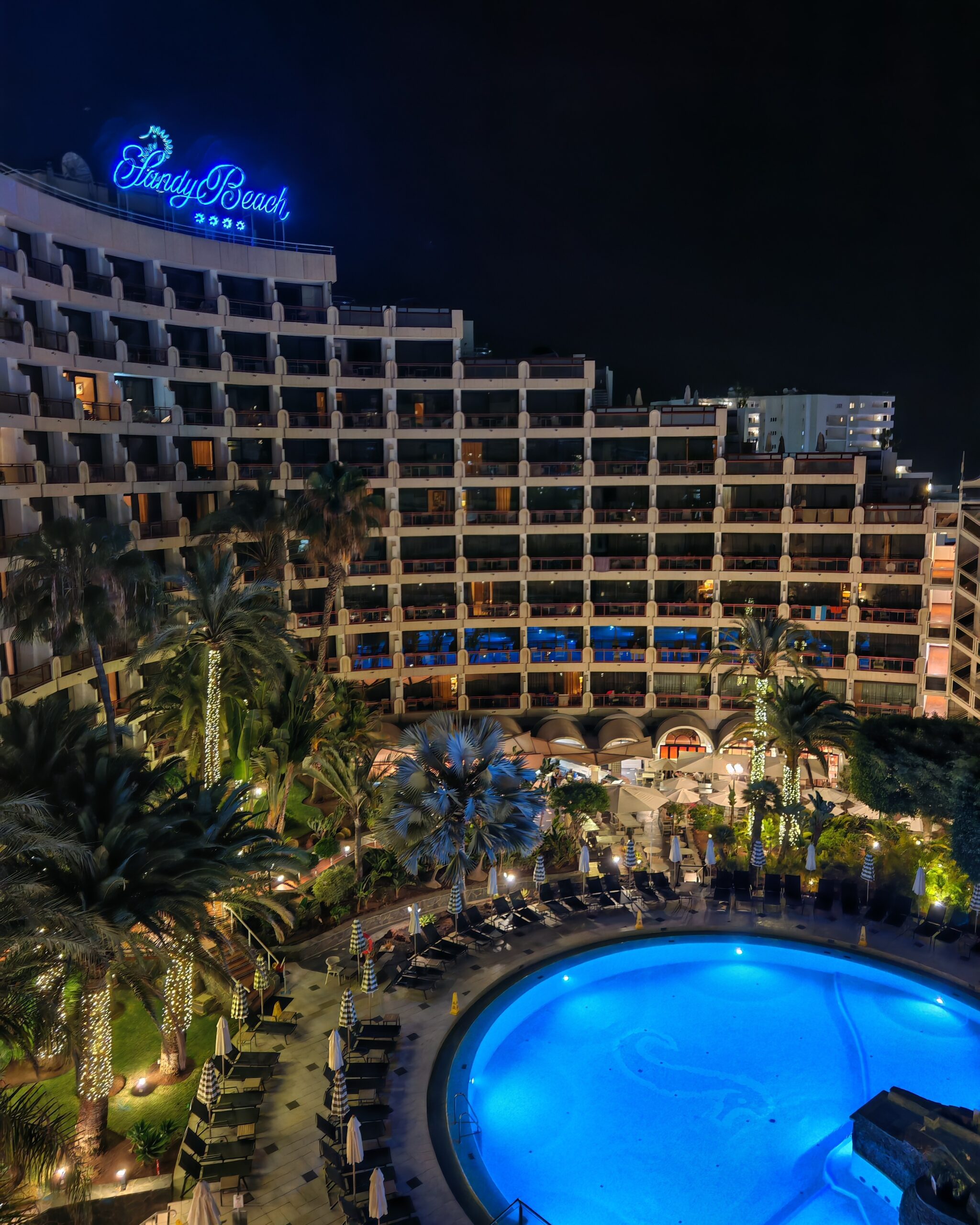 Night time view of the Seaside Sandy Beach Hotel pool in Maspalomas, Gran Canaria from the 6th floor