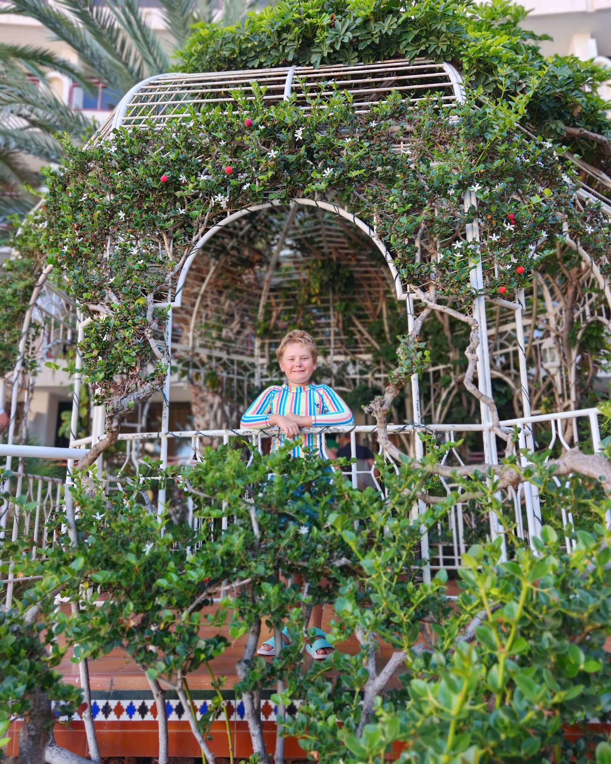 White little boy in his swimming costume standing at the Sandy Beach Hotel in Maspalomas, Gran Canaria