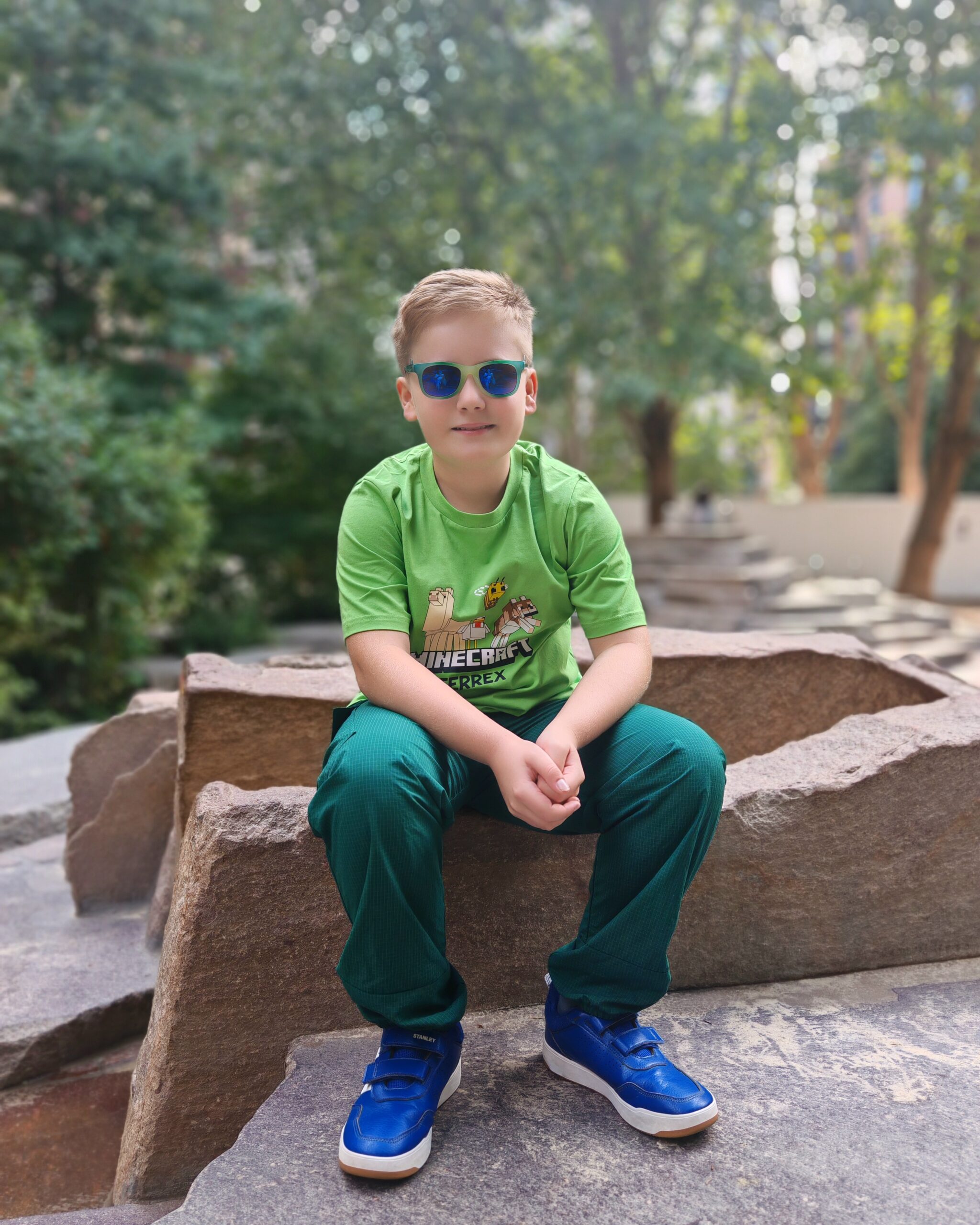 White little boy wearing a bright green tee from the latest adidas x Minecraft Collaboration at a playground in Elephant & Castle