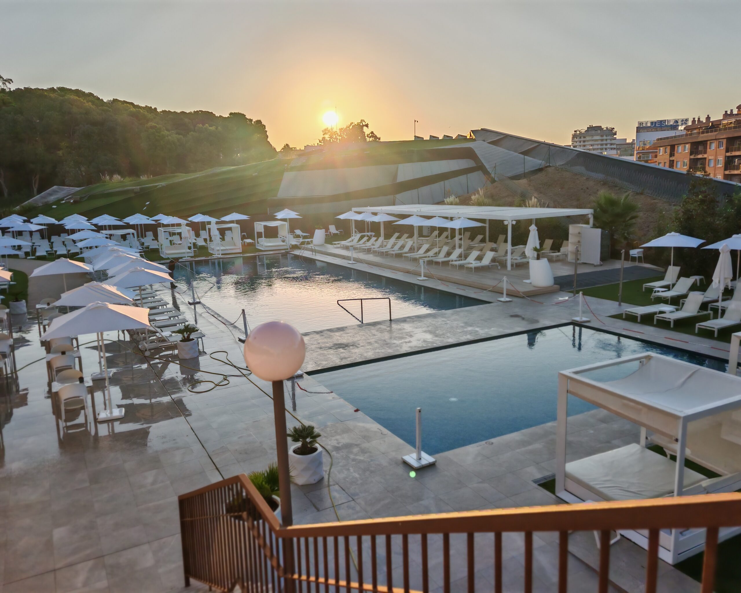outside pool of the Melia Lloret de Mar hotel in Spain where you can see the sunset in the morning. the light is reflecting in the water and it's a beautiful light. outside pool of the Melia Lloret de Mar hotel in Spain where you can see the sunset in the morning. the light is reflecting in the water and it's a beautiful light.