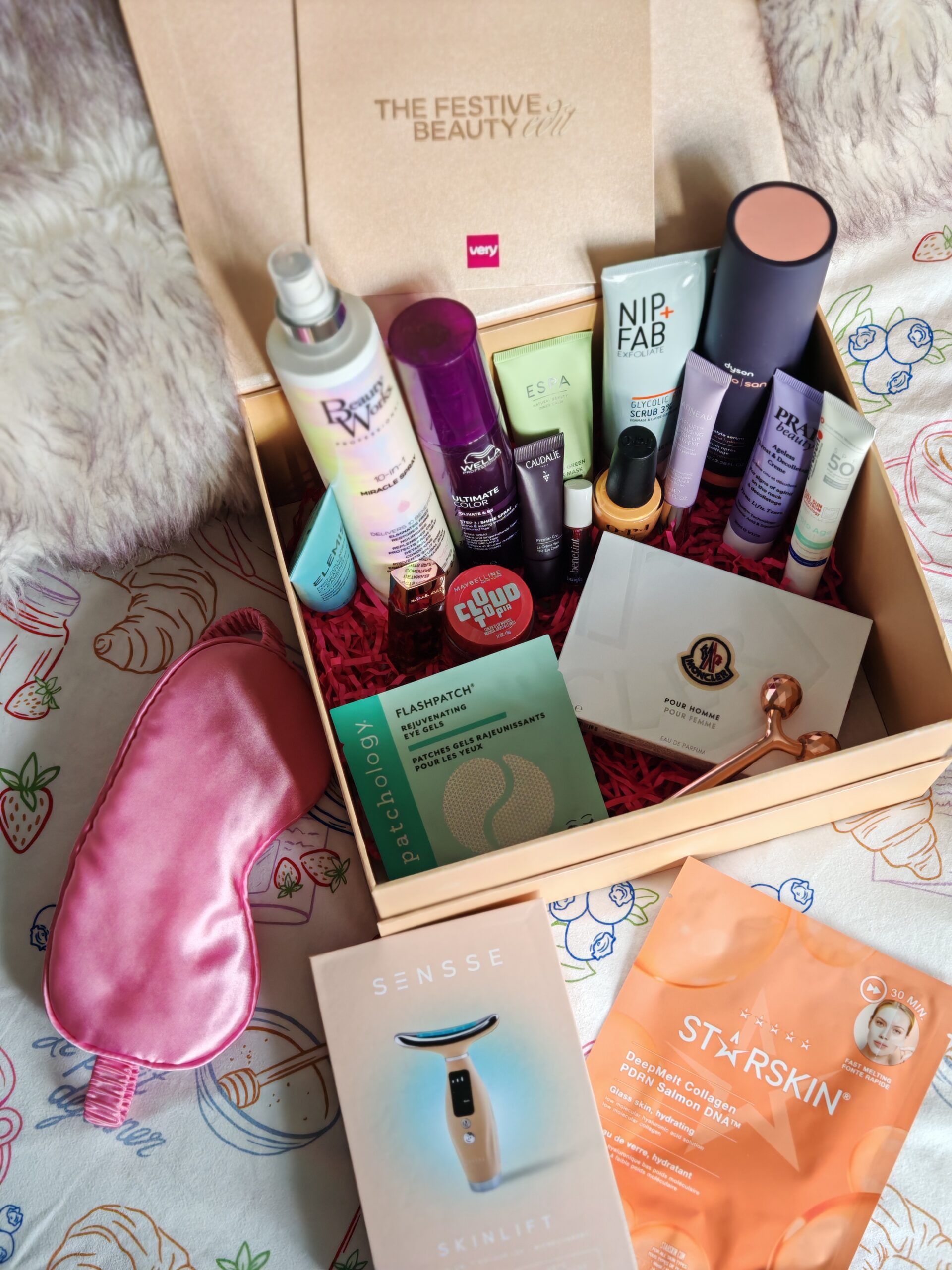 Very UK Festive Beauty Box with all the products in the box with skincare, sculpting tools and pink face mask on the side Very UK Festive Beauty Box with all the products in the box with skincare, sculpting tools and pink face mask on the side