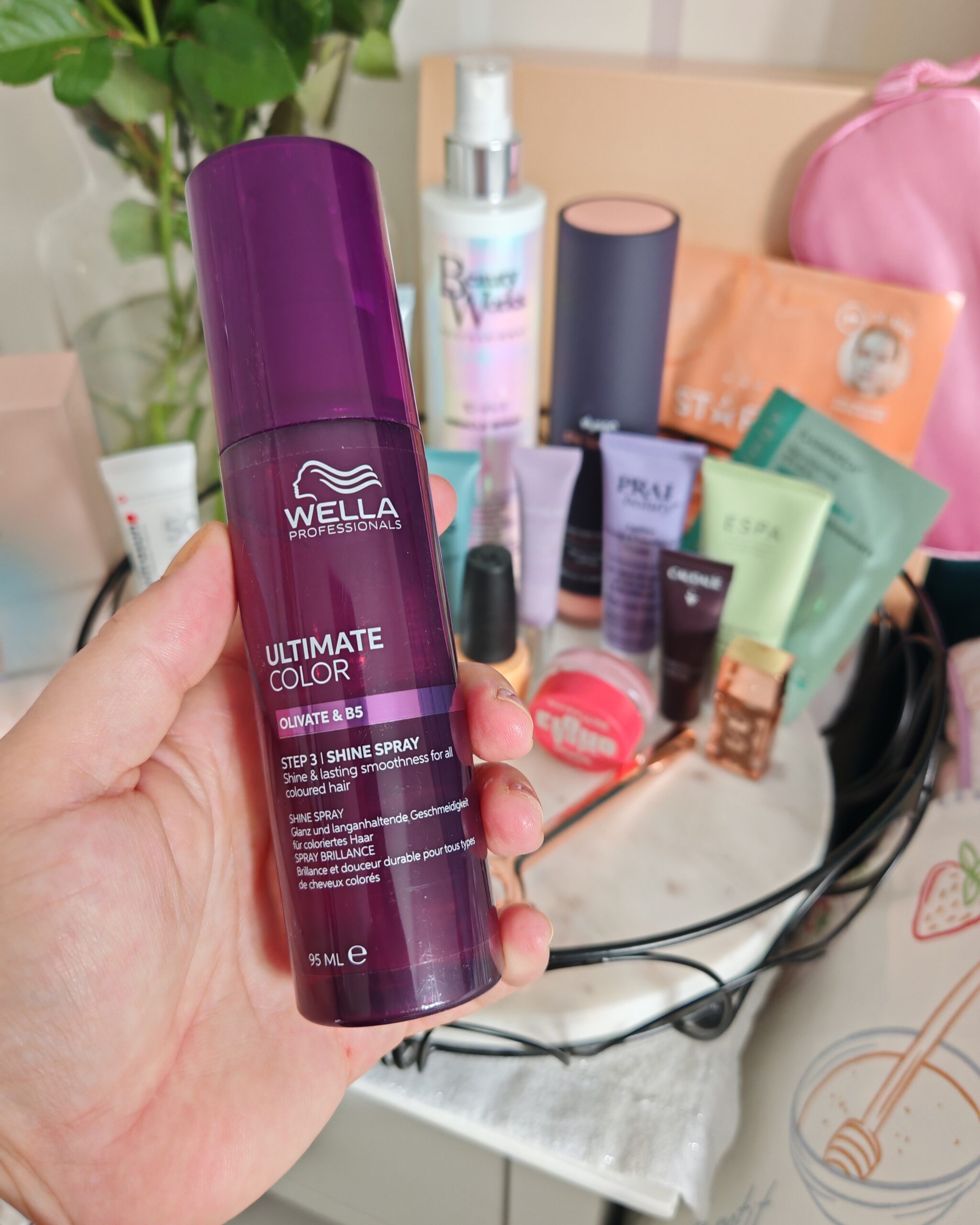 Very UK Festive Beauty Box with all the products in the background while zooming on the ultimate colour shine spray by Wella Very UK Festive Beauty Box with all the products in the background while zooming on the ultimate colour shine spray by Wella